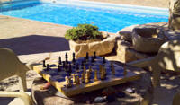 The pretty Carythia cottage a lovelyplace for a game of chess in the gardens near Paphos in Cyprus