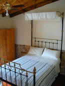 A traditional four poster bed is a feature of this lovely cottage in Ayia Anna in Cyprus