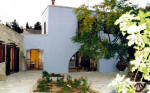 Garden Kamara House in Kato Drys - An agrotourism holiday house in Cyprus - The courtyard with flagstones and vines