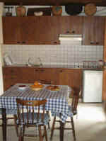 The kitchen is a country style area full of charachter.