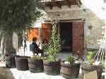 Vouni Lodge has a large stone courtyard and the top apartments offer lovely views. - click to enlarge.