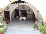 The stratos house covered courtyard with arches and Cyprus character